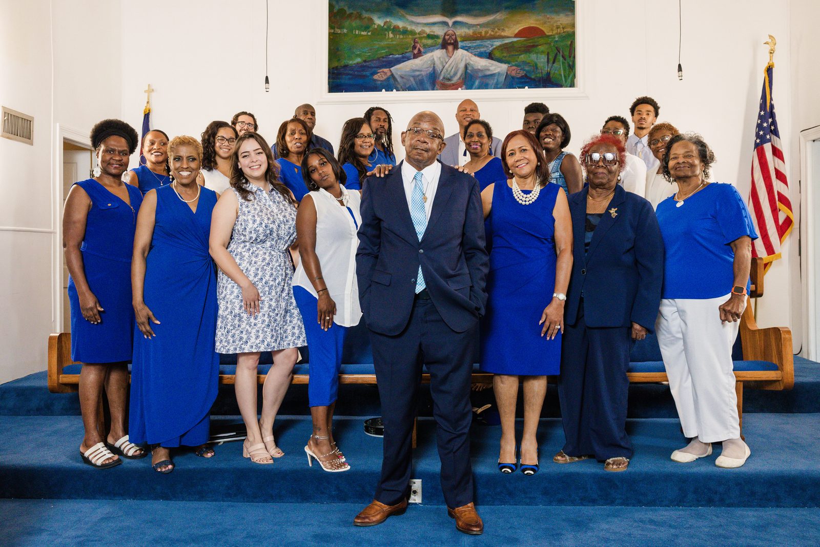 Pastor with women of the church in royal blue