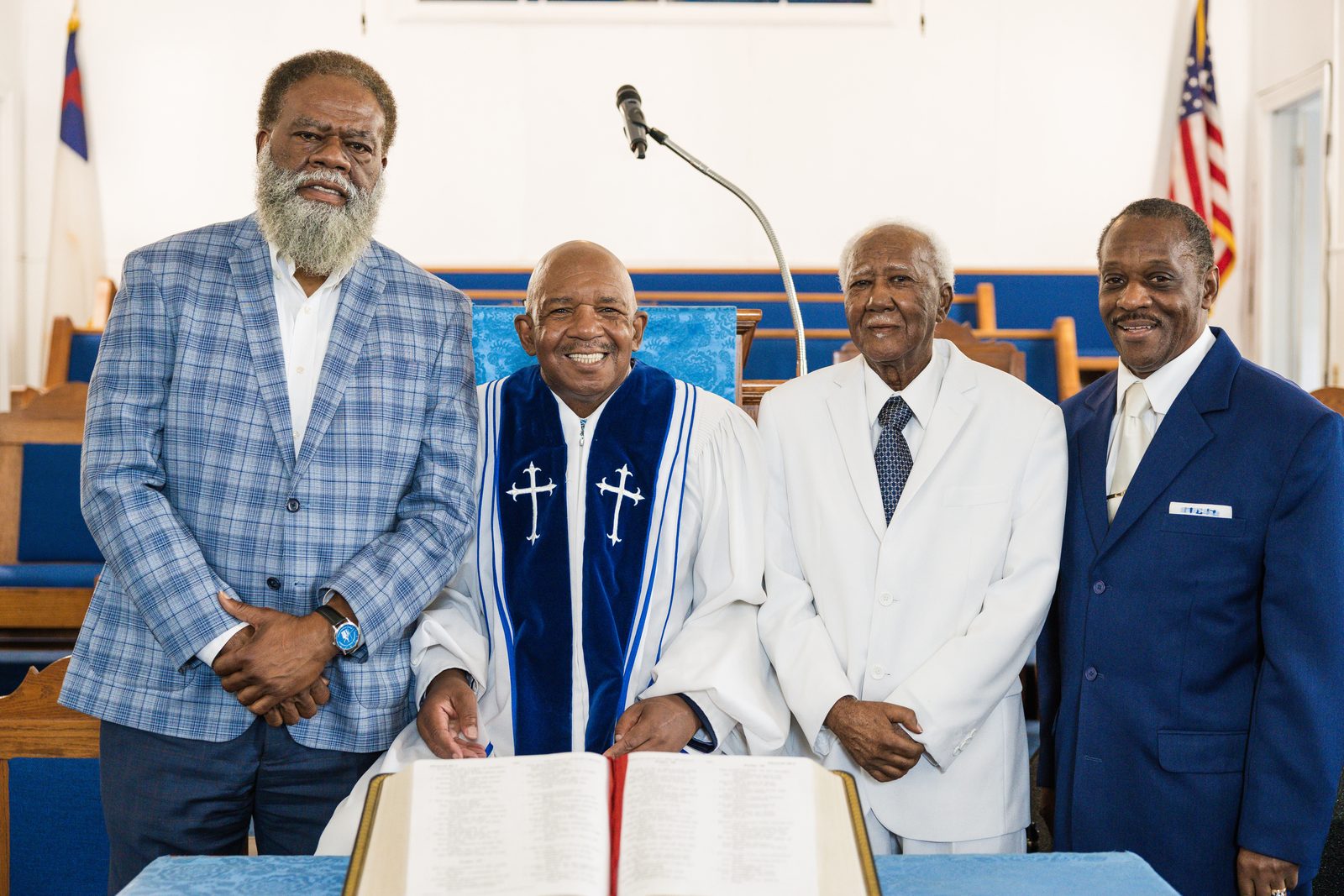 Pastor in his robe with church leaders