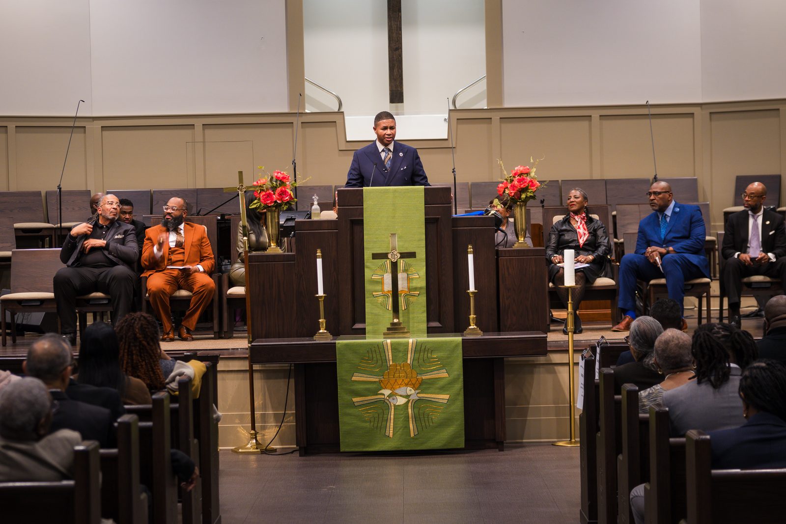 Preacher at the pulpit with green paraments