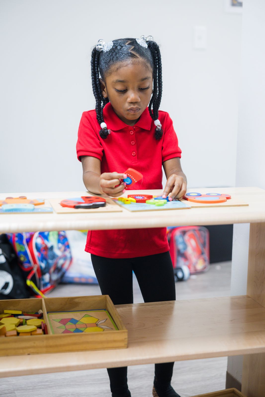 Student working with Montessori materials on the first day of school