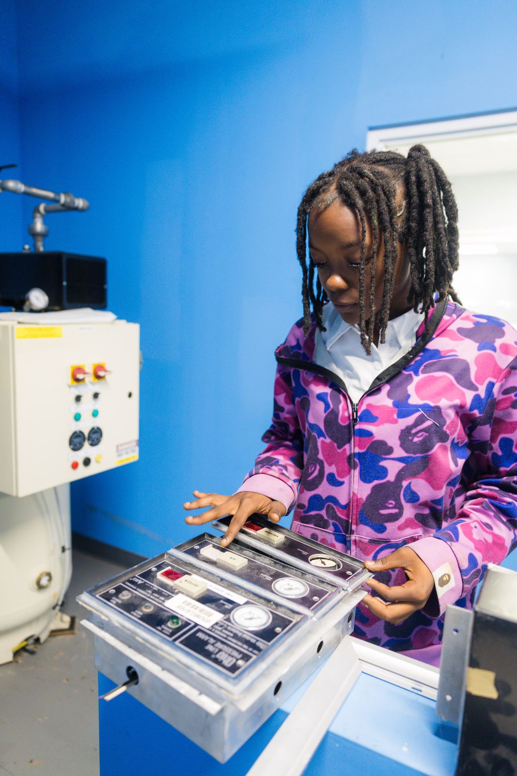 High school student testing equipment during a career exploration day