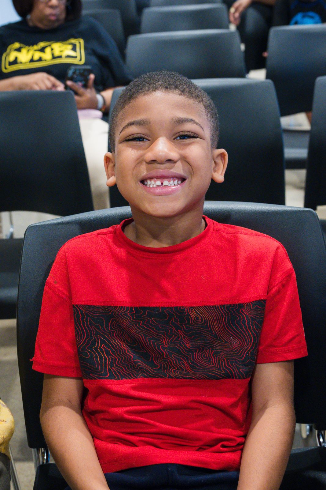 Student smiling at an Invictus family event