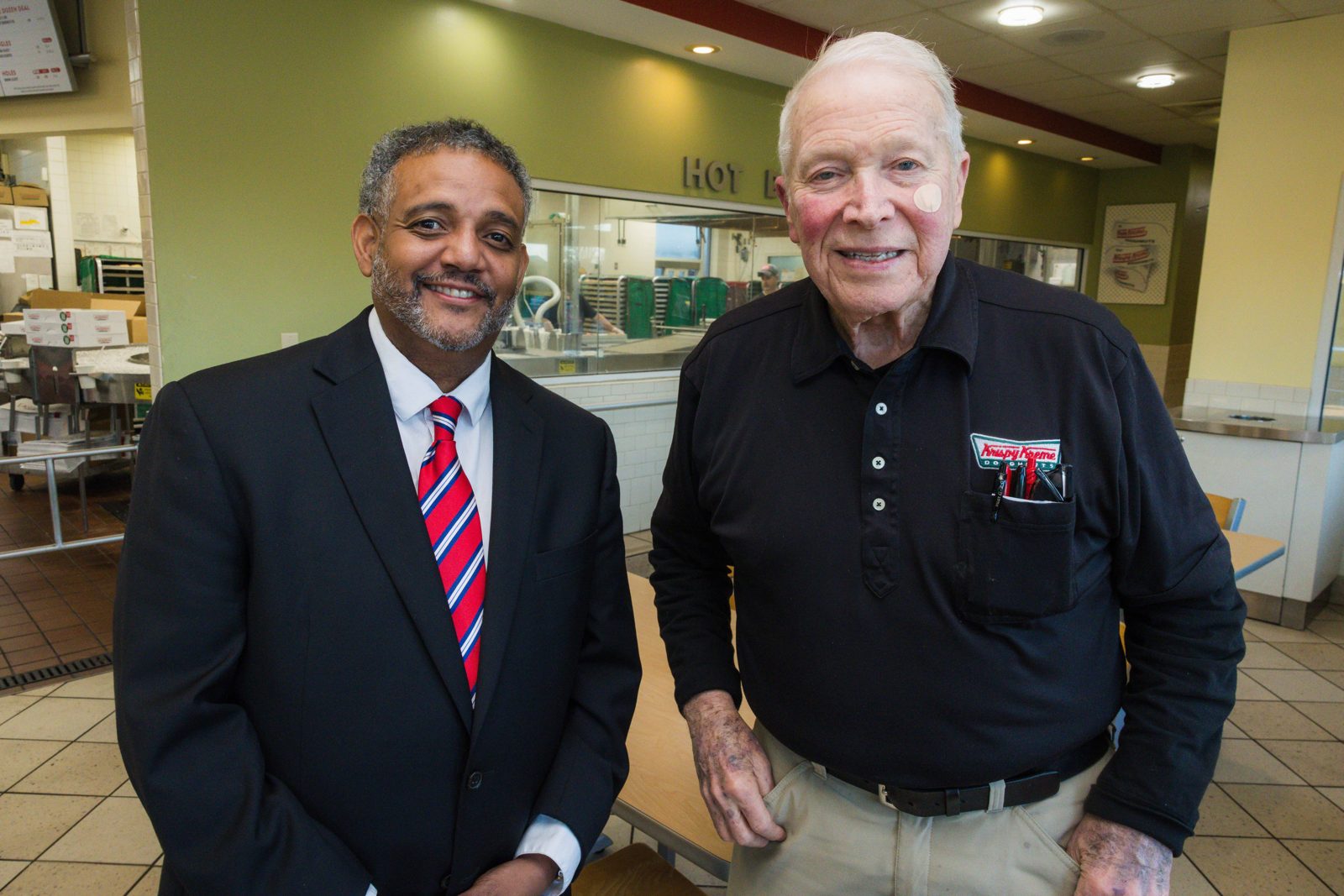 Brandon Brown with former State Sen. Glenn Reese at his Spartanburg Krispy Kreme