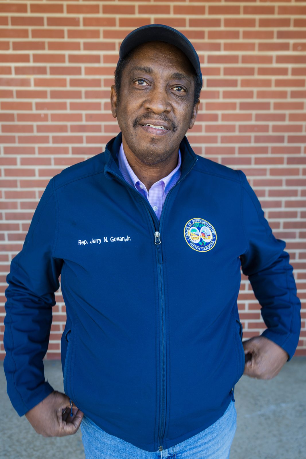 Rep. Jerry Govan standing against a brick wall