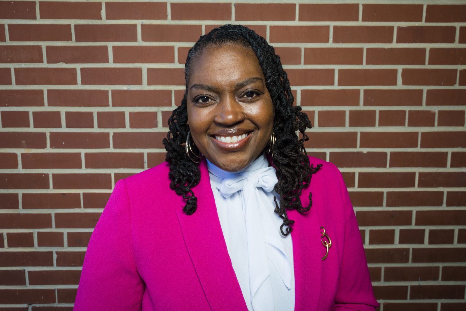 Councilwoman Annette Dees Grevious smiling against a brick wall