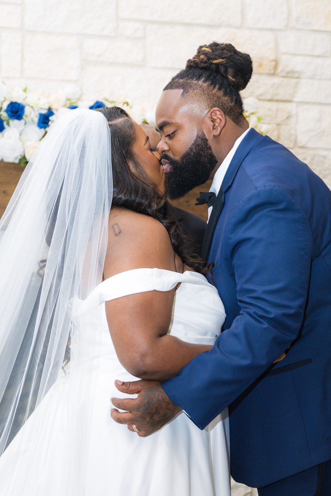 Kenyon and Alea kiss at the altar