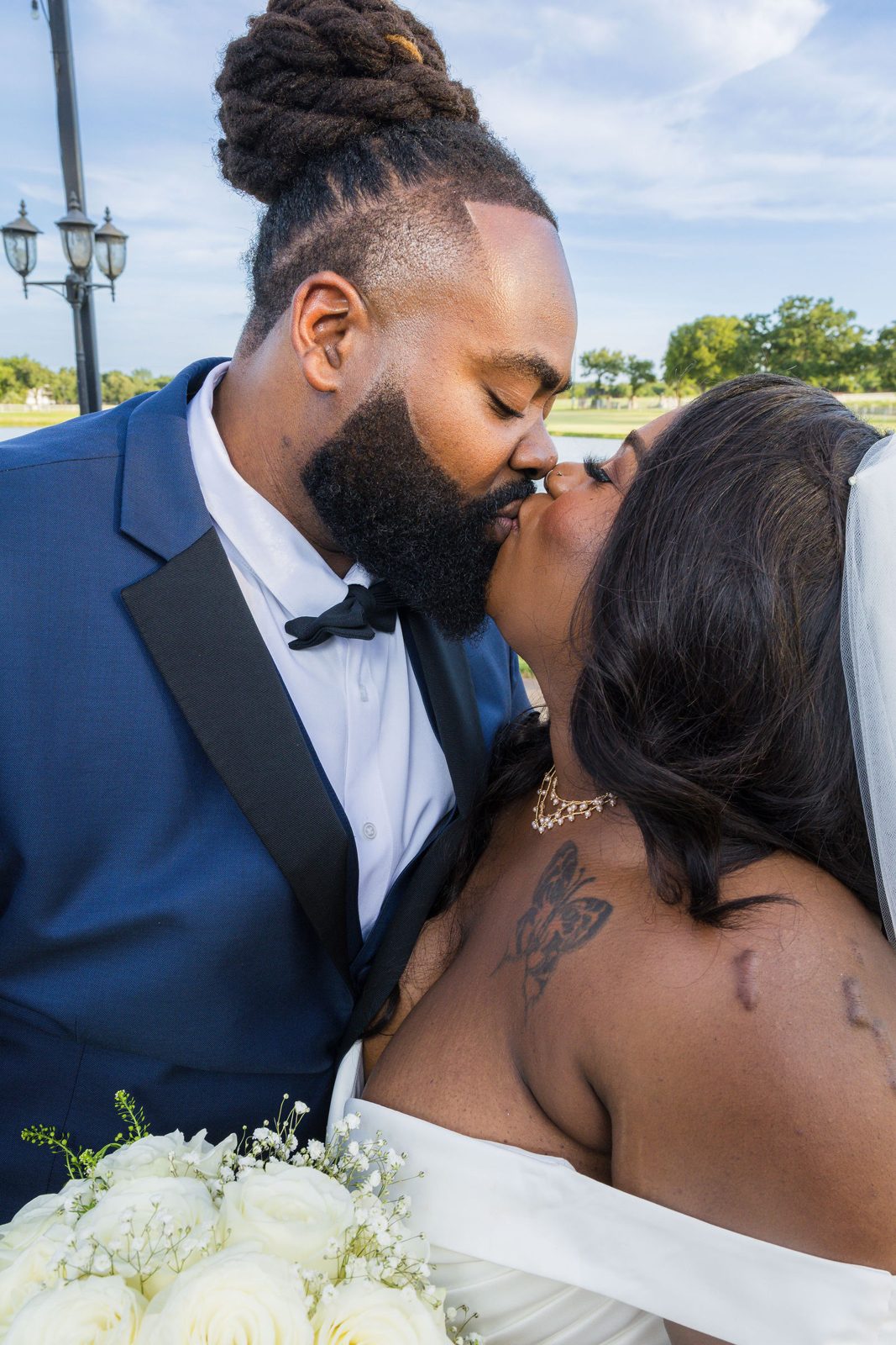 Kenyon and Alea share a kiss during their portraits