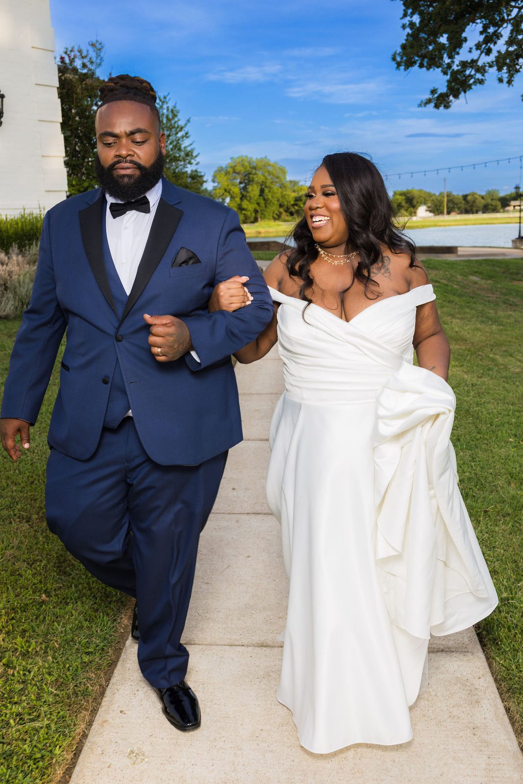 Kenyon and Alea walking arm in arm by the lake