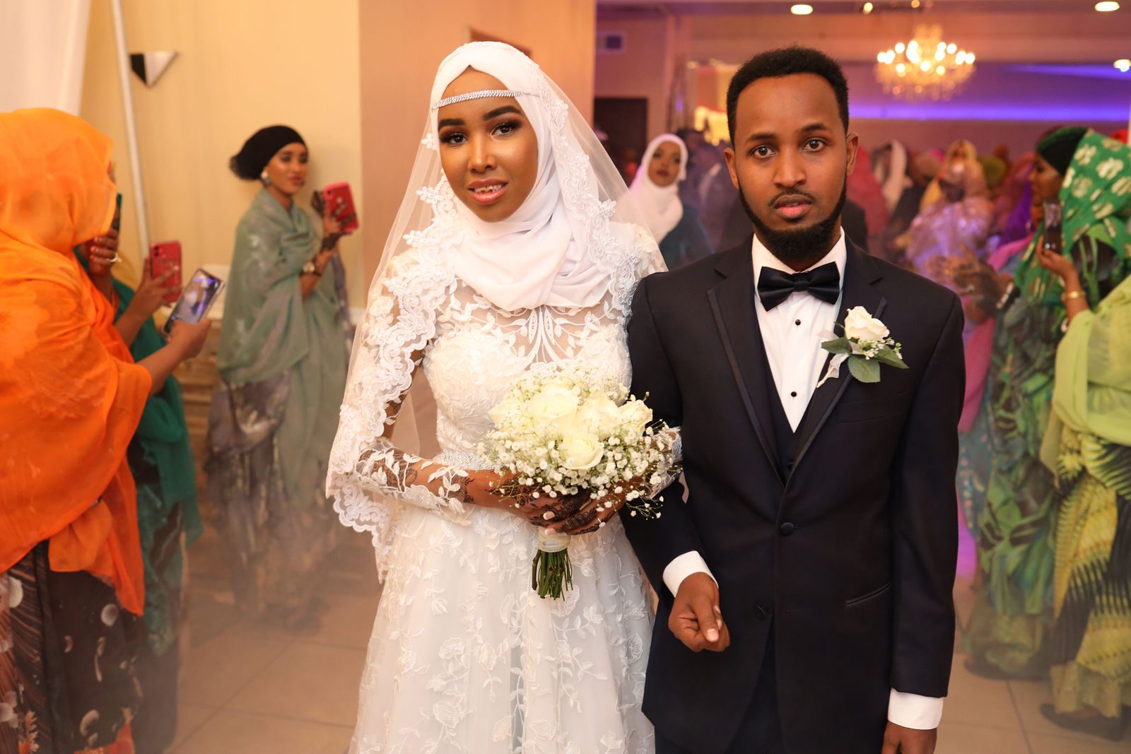 Bride and groom enter the reception